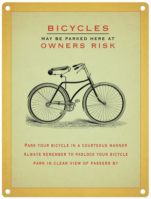Bicycles may be parked here at owners risk sign