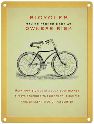 Bicycles may be parked here at owners risk sign