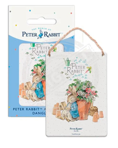 Peter Rabbit asleep next to flower pot metal sign