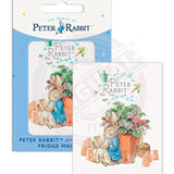 Peter Rabbit asleep next to flower pot fridge magnet