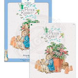 Peter Rabbit asleep next to flower pot metal sign