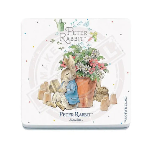 Peter Rabbit asleep next to flower pot metal sign