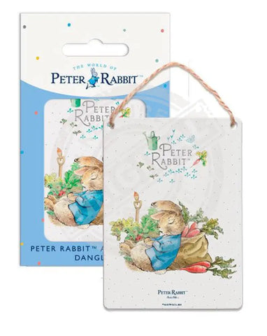 Peter Rabbit asleep next to radish sack metal sign